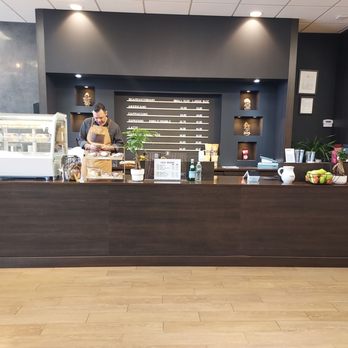 Cafe Victoria and Market - a man standing behind a counter - Coffee & Tea Near Me - Riverhead, New York