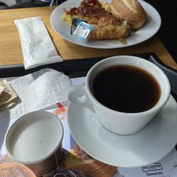 Ham and cheese croissant breakfast w coffee Ham and cheese croissant breakfast w coffee