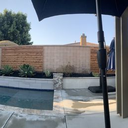 Landscaping surrounding yard and custom wood panels. Landscaping surrounding yard and custom wood panels.