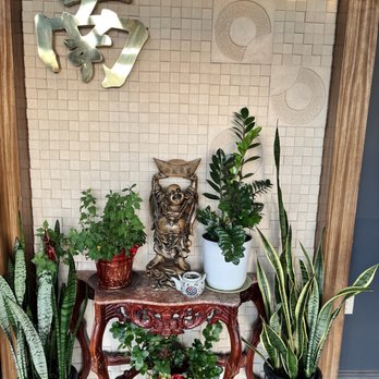 Hunan Garden Restaurant - an owl statue on a table surrounded by potted plants - Chinese Near Me - Kingwood, Texas Hunan Garden Restaurant - an owl statue on a table surrounded by potted plants - Chinese Near Me - Kingwood, Texas