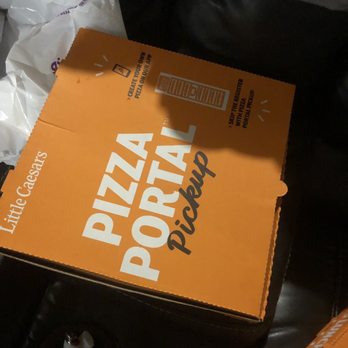 Little Caesars - a pizza box on a couch - Pizza Near Me - Harrison, Ohio