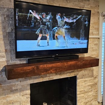 TVSC Solutions - TV and soundbar mounted on brick above the fireplace in MD - Home Theatre Installation Near Me - Hagerstown, Maryland