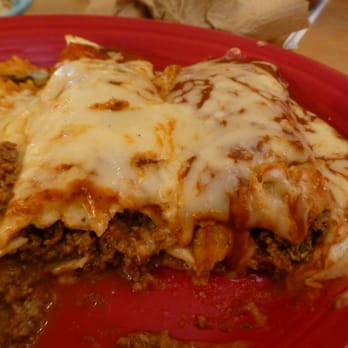 Las Barricas - One is an enchilada, one is a burrito. Same size same filling same topping - Mexican Near Me - Franklin, North Carolina Las Barricas - One is an enchilada, one is a burrito. Same size same filling same topping - Mexican Near Me - Franklin, North Carolina