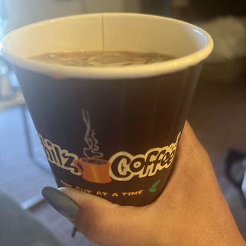 Philz Coffee - a hand holding a cup of coffee - Coffee & Tea Near Me - Menlo Park, California Philz Coffee - a hand holding a cup of coffee - Coffee & Tea Near Me - Menlo Park, California