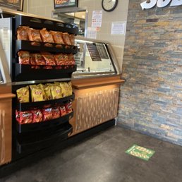 a counter with chips and snacks a counter with chips and snacks