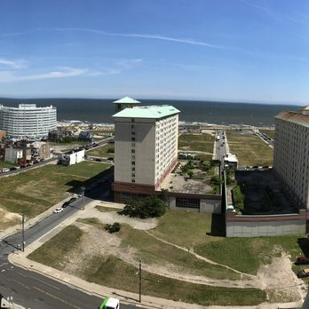 Absecon Lighthouse - View from top of Absecon Lighthouse looking out door to the left at apt bldg & Atlantic Ocean - Landmarks & Historical Buildings Near Me - Atlantic City, New Jersey