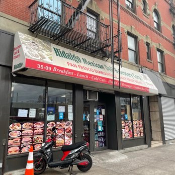 Hidalgo Mexican Food - a motorcycle parked in front of a restaurant - Mexican Near Me - Astoria, New York Hidalgo Mexican Food - a motorcycle parked in front of a restaurant - Mexican Near Me - Astoria, New York