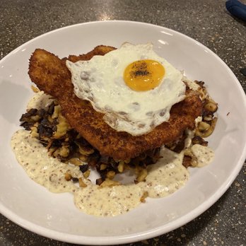 Bibinger's - Schnitzel topped with a fried egg, over spatzle and some mystery sauce. - Gastropubs Near Me - Slinger, Wisconsin