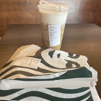 Starbucks - a cup of coffee and a bag of coffee on a table - Coffee & Tea Near Me - Sandusky, Ohio Starbucks - a cup of coffee and a bag of coffee on a table - Coffee & Tea Near Me - Sandusky, Ohio