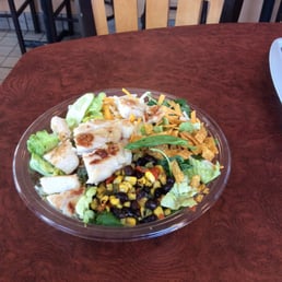 a salad in a bowl on a table a salad in a bowl on a table