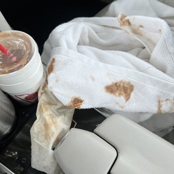 Smoothie King - This is after clean up. My cup holder is perfect. No snags. Luckily I had a dog towel in back seat. My top will need dry cleaning shorts - Juice Bars & Smoothies Near Me - Fairhope, Alabama