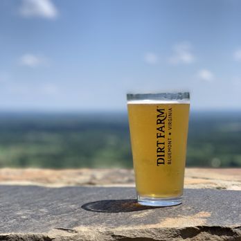 Dirt Farm Brewing - a glass of beer sitting on a stone ledge - Breweries Near Me - Bluemont, Virginia