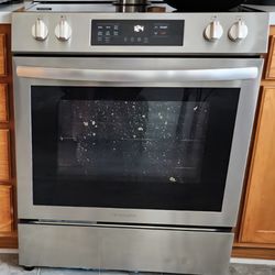 Tekniton - Stain on inner glass of stove.