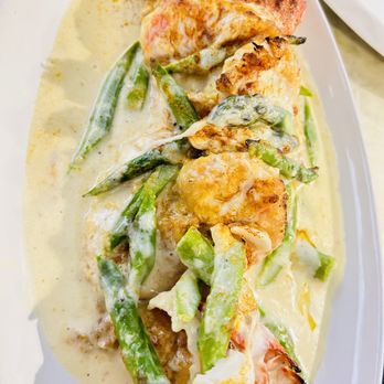 Salute Ristorante - Veal and shrimp Monte Carlo egg butter sautéed with fresh asparagus with brandy cream sauce top with jumbo crab meat and mozzarella cheese - Italian Near Me - Morrisville, Pennsylvania Salute Ristorante - Veal and shrimp Monte Carlo egg butter sautéed with fresh asparagus with brandy cream sauce top with jumbo crab meat and mozzarella cheese - Italian Near Me - Morrisville, Pennsylvania