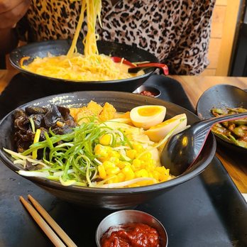 Ramen Hakata - Spicy miso vegetable ramen (far), vegetarian miso ramen (spicy on the side), plus the prettiest girl. - Ramen Near Me - Addison, Texas