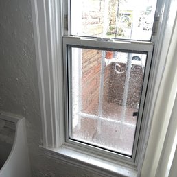 Water pouring into home from rain gutter Water pouring into home from rain gutter