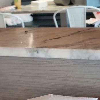 Crust Kitchen - A booth that is being use for employees to get to go order items prepared. - Pizza Near Me - San Diego, California
