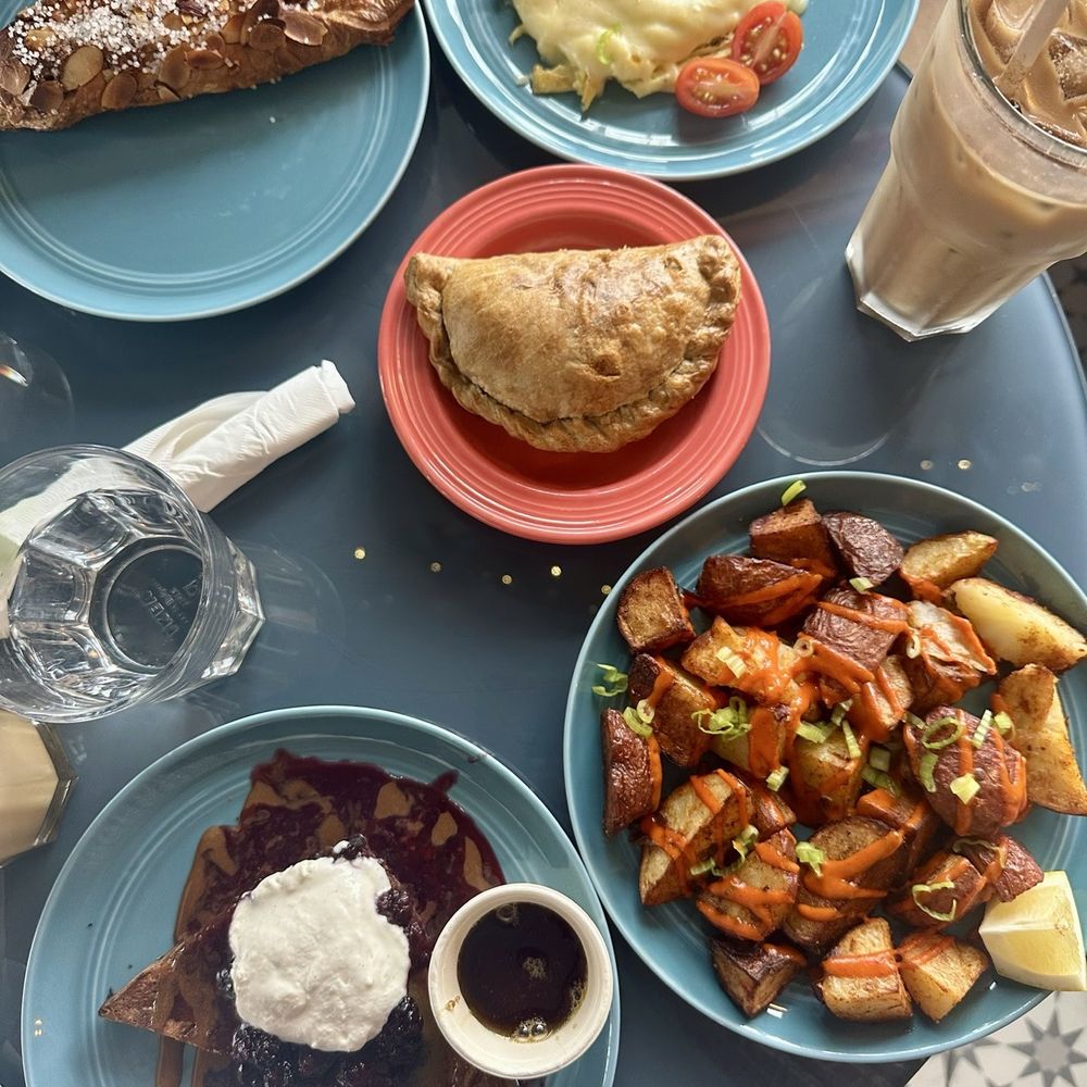 French toast, empanada, potatoes, scone, eggs, iced latte
