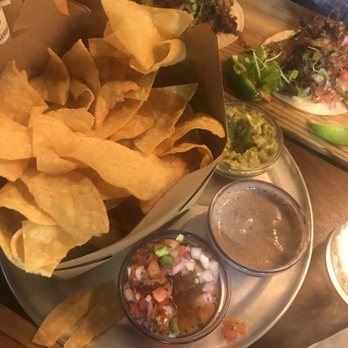 M Cantina - Chips and Salas with Crispy Goat Tacos in back - Mexican Near Me - Dearborn, Michigan M Cantina - Chips and Salas with Crispy Goat Tacos in back - Mexican Near Me - Dearborn, Michigan