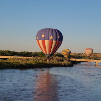 World Balloon - Another World balloon kissing the Rio Grande - Hot Air Balloons Near Me - Albuquerque, New Mexico
