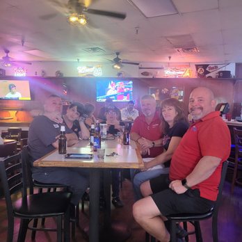 Simpleton's - a group of people sitting at a table - Sports Bars Near Me - Mesa, Arizona