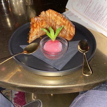 Devil May Care - Pistachio baklava with raspberry sorbet, it was delicious. - Lounges Near Me - Austin, Texas