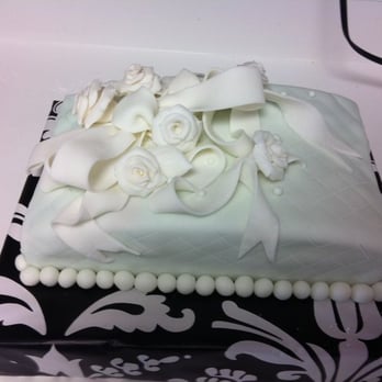 Flour&Soul - a cake with white icing and flowers - Bakeries Near Me