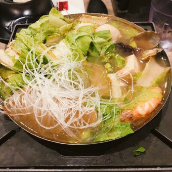 Boiling Point - Seafood & Tofu w/ med spice. Bland at first but added chili oil & bean curd paste for spiciness & flavor. Clams w/ a lot of sand :/ - Taiwanese Near Me - Seattle, Washington