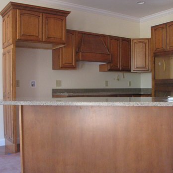 Laylon Construction - a kitchen with an island counter - General Contractors Near Me Laylon Construction - a kitchen with an island counter - General Contractors Near Me