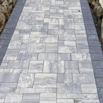 Edland Landscaping - a brick walkway with a stone border - Landscaping Near Me - Bridgeport, Connecticut