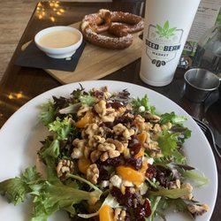 Mandarin oranges, walnuts, cranberries, and goat-cheese with citrus-vinaigrette dressing, plus a pretzel and beer-cheese.