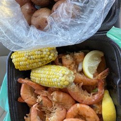 Buddy's Seafood Market - Steamed shrimp, new red potatoes, and FRESH corn on the cob. Yuuuuuum!!