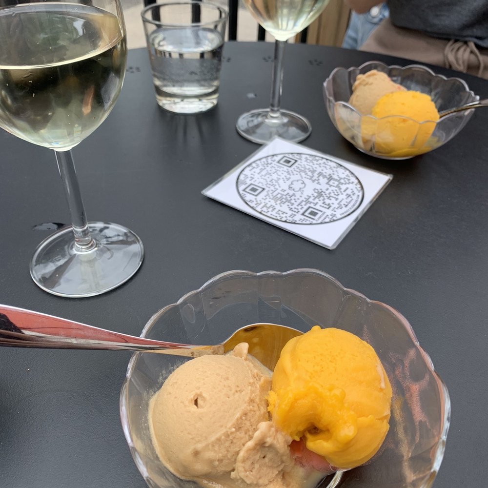 a glass of wine and a bowl of ice cream