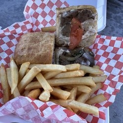 Lomo Saltado sandwich with fries