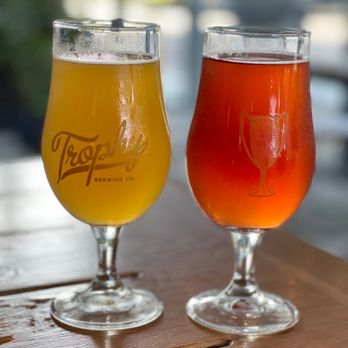 Trophy Brewing - two glasses of beer on a table - Bars Near Me - Raleigh, North Carolina Trophy Brewing - two glasses of beer on a table - Bars Near Me - Raleigh, North Carolina