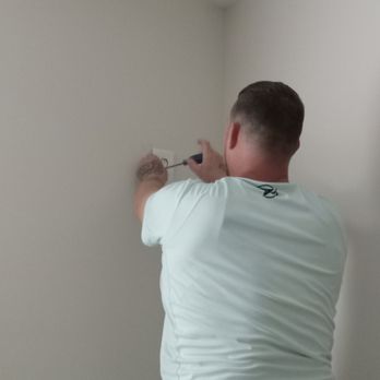 Chris and Sons - Me moving a receptacle up before mounting a TV - Handyman Near Me