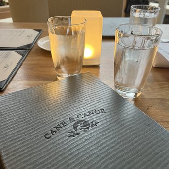 Cane & Canoe - Table setting with Menu - Cocktail Bars Near Me - Lahaina, Hawaii
