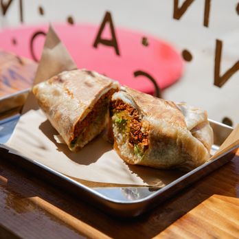 Mañana Venice - a burrito cut in half on a tray - Coffee & Tea Near Me - Los Angeles, California Mañana Venice - a burrito cut in half on a tray - Coffee & Tea Near Me - Los Angeles, California