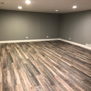 Global Home Improvement - Finished basement with new laminate floors. - General Contractors Near Me