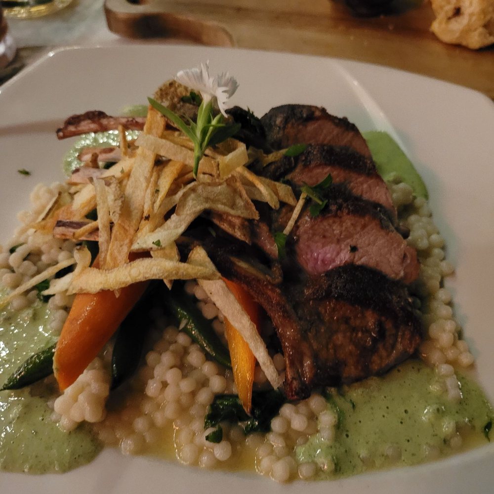 The Ranch House - Rack of lamb with couscous, veggies and a mint yogurt (with some chips?). - Venues & Event Spaces Near Me - Ojai, California The Ranch House - Rack of lamb with couscous, veggies and a mint yogurt (with some chips?). - Venues & Event Spaces Near Me - Ojai, California
