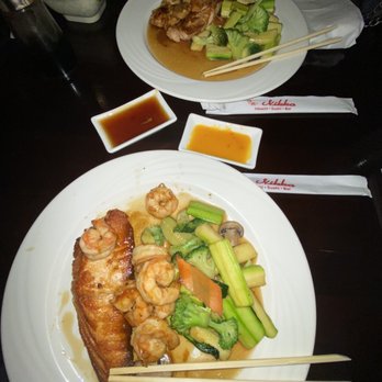 Nikko Hibachi - Closes plate (Shrimp and Salmon Teriyaki hibachi Combo) farthest plate (shrimp and chicken teriyaki hibachi combo) - Japanese Near Me - Fresh Meadows, New York