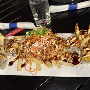 Grillers Puerto Rico - Bosu roll (avocado, churrasco, cream cheese, and sweet plantain on top) spicy crab on top of fries - Latin American Near Me - Orlando, Florida Grillers Puerto Rico - Bosu roll (avocado, churrasco, cream cheese, and sweet plantain on top) spicy crab on top of fries - Latin American Near Me - Orlando, Florida