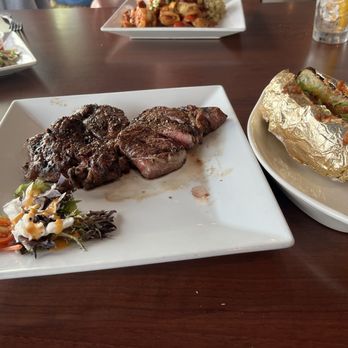 St Johns River Steak & Seafood - Ribeye with loaded, baked potato - Seafood Near Me - Sanford, Florida St Johns River Steak & Seafood - Ribeye with loaded, baked potato - Seafood Near Me - Sanford, Florida