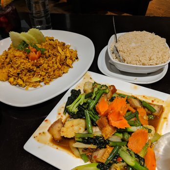 Thai Bloom - Moo Grop Stir-Fry with brown rice and Pineapple fried rice. - Thai Near Me - Beaverton, Oregon Thai Bloom - Moo Grop Stir-Fry with brown rice and Pineapple fried rice. - Thai Near Me - Beaverton, Oregon