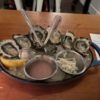 Barnacle - a platter of oysters with dipping sauce - Wine Bars Near Me - Seattle, Washington Barnacle - a platter of oysters with dipping sauce - Wine Bars Near Me - Seattle, Washington