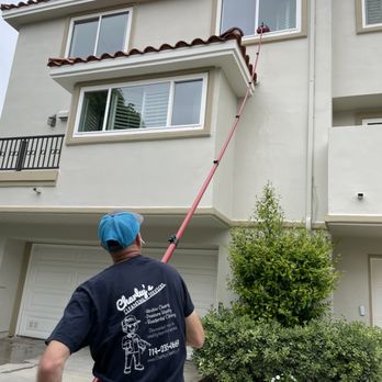 Charley's Cleaning Services - Carlos Sr. In action with our water fed system on this 3 story condo in Huntington Beach. - Window Washing Near Me - Irvine, California