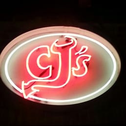 a neon sign in the dark a neon sign in the dark
