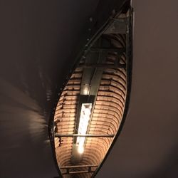 Timber Lounge Axe Throwing - A historic plank and canvas canoe garnishes our ceiling as a lamp shade