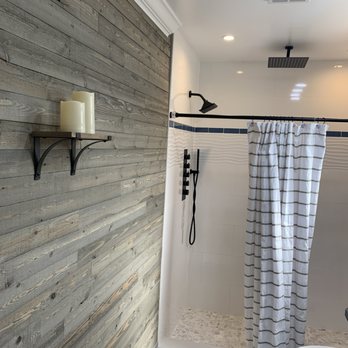 Henry’s Services Enterprise - a bathroom with a wooden wall - General Contractors Near Me Henry’s Services Enterprise - a bathroom with a wooden wall - General Contractors Near Me