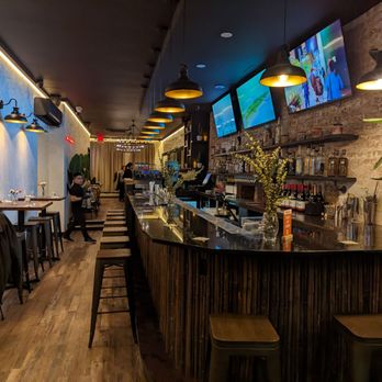 Miatzil - a restaurant with a bar and a television - Mexican Near Me - Brooklyn, New York